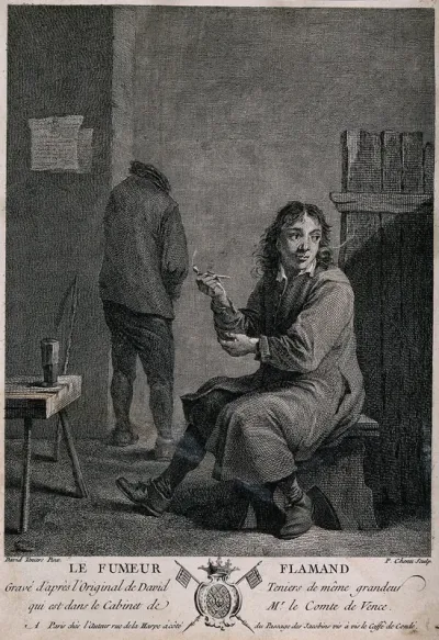 A man sits on a stool smoking a pipe, behind a man relieves himself against the wall
