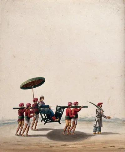 A man sitting in a portable chair carried by four bearers along with a servant holding an umbrella, lead by a man with a sword