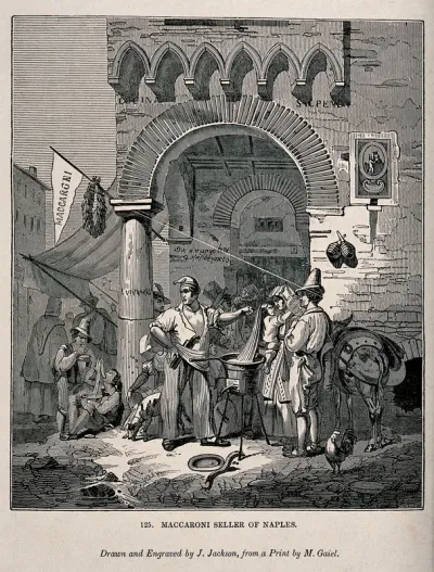 A man stands at the corner of the street selling macaroni to the passers by