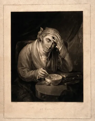 A man stirring his broth contemplates his injured head which he holds with his hand