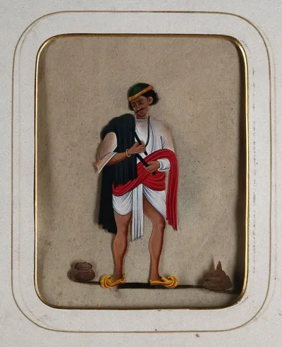A man wearing a green cap with a black shawl draped over his shoulder holding two sticks (?)