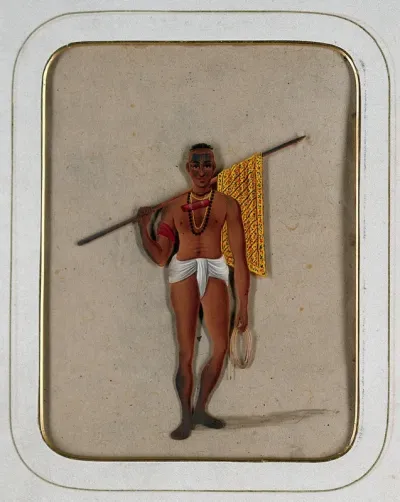 A man wearing a loin cloth holding a stick with a piece of cloth draped around it and a coil of string