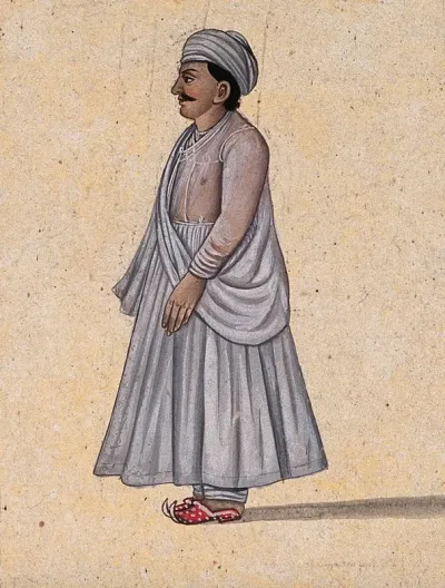 A man wearing a 'Lucknow-style', angarakha kurta and pyjama (dress)