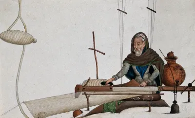 A man weaving cloth