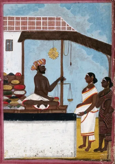 A man weighing sweet meats to sell to women in a bazaar