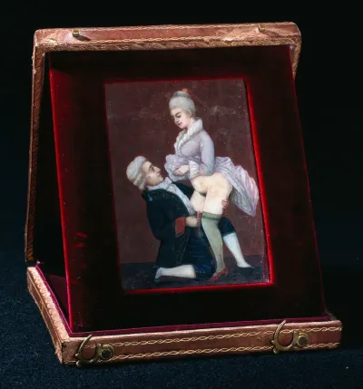 A man with one knee on the ground and a standing woman about to engage in sexual intercourse