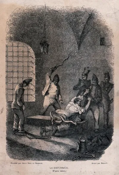 A manacled prisoner is stripped to the waist and restrained by prison warders while he is beaten with a lash