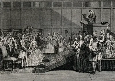 A marriage ceremony is performed with the priest in the pulpit and the couple standing before two cushions which they shall kneel on when they take their vows