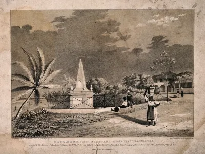 A monument positioned near the military hospital in Barbados, with passers-by
