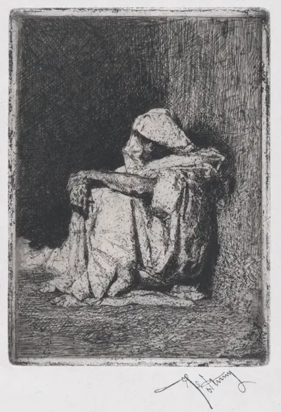 A Moroccan man seated on the ground