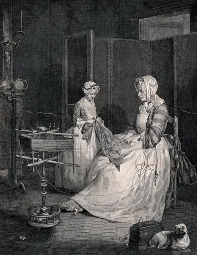 A mother and daughter reviewing embroidery made by the daughter; a yarn-winder stands nearby