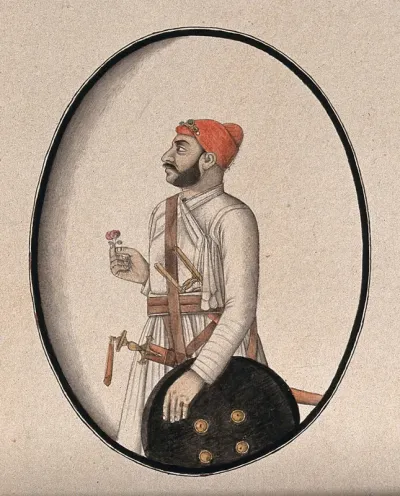 A Mughal courtier wearing a red turban and carrying a sword, dagger and shield