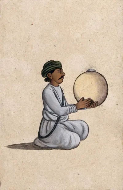 A musician playing a daf (Indian tambourine, with no jingles)