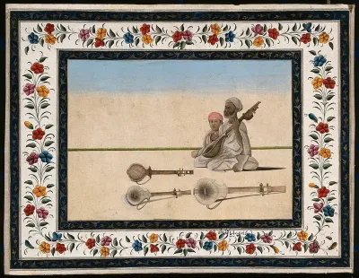 A musician playing a string instrument, with other instruments on the ground