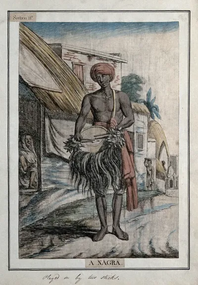 A musician with a nagra, a type of drum played with sticks, Calcutta, West Bengal