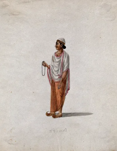 A Muslim priest holding prayer beads