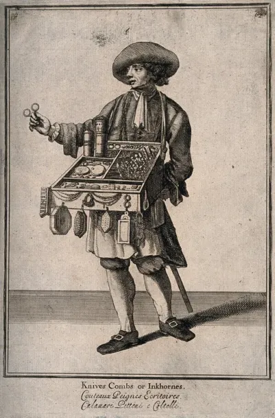 A pedlar with his tray of wares holds up a pair of scissors