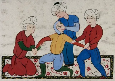 A Persian surgeon performing an eye operation on a man held by two other men