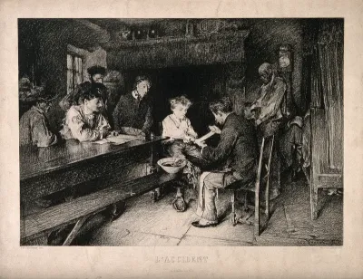 A physician bandaging the hand of a boy, who is surrounded by his large family