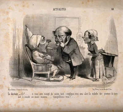 A physician examines a patient's tongue