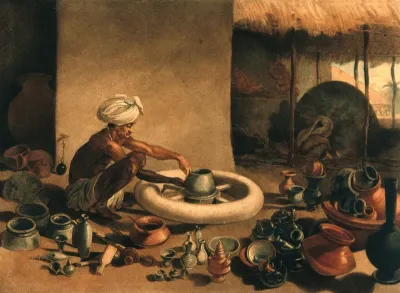 A potter at work, with all the various utensils made surrounding him