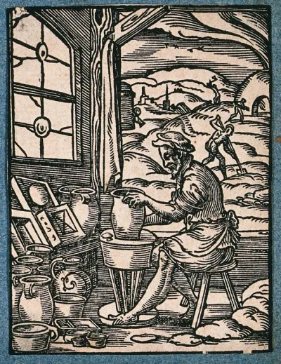 A potter making clay pots on a wheel