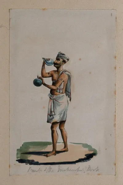 A priest blowing a conch shell