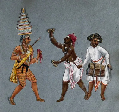 A priest exorcist, with two men playing cymbals and drums