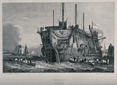 A prison ship in the River Thames at Deptford: rowing boats convey prisoners between land and the ship