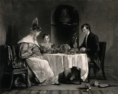 A Quaker family are sitting at the dinner table and the father has his hands together as he gives thanks for the food