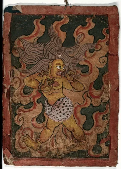 A red and yellow Tibetan demon, surrounded by flames, about to gobble a man