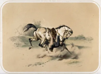 A rider has slipped sideways from his saddle and is trapped underneath his cantering horse with one foot in the stirrup; he clings with his hands to the rein and harness