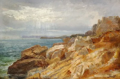 A rocky coast. The sun is breaking through the sky