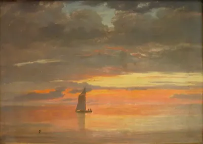 A sailing ship at sunset.