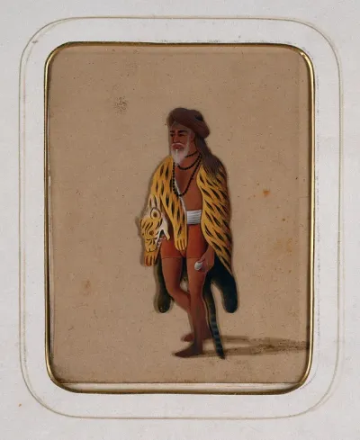 A sanyasi with a tiger skin wrapped around himself