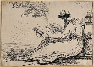 A seated man holding a large book