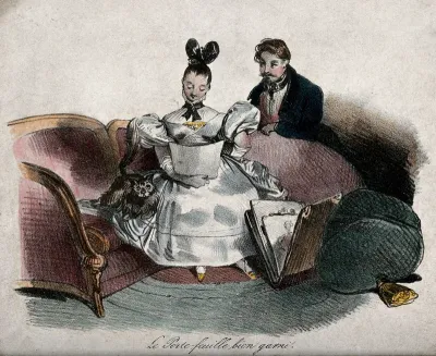 A seated woman studying a drawing or print with a man at her side