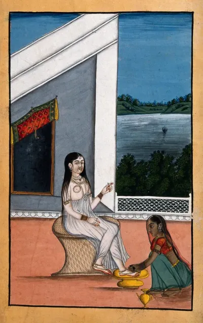A servant attending to an Indian lady's feet