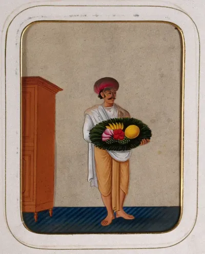 A servant holding a platter of fruit