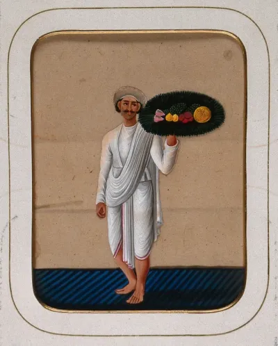 A servant holding up a platter of fruit