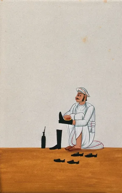 A servant polishes boots and other shoes