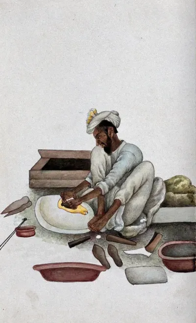 A shoemaker making slippers