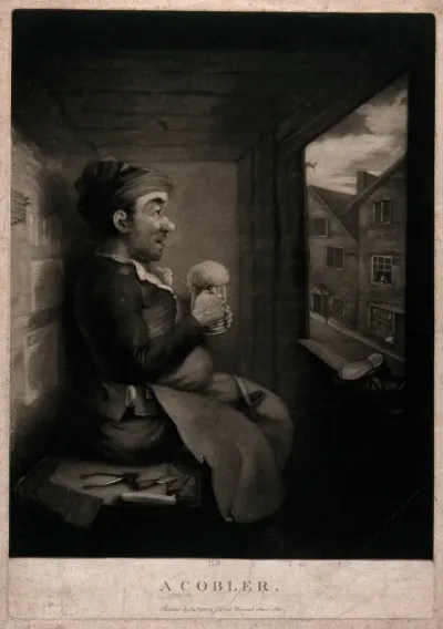 A shoemaker sits on a bench with a tankard of ale in his hands, his tools are lying around him and a pair of shoes are on the window sill