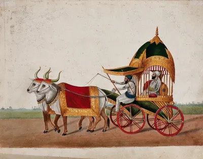 A Sikh man riding in an elaborate domed carriage pulled by two oxen