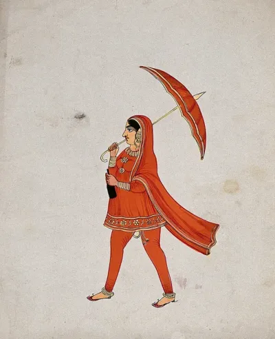 A Sikh (?) woman in a bright orange dress holding an umbrella and walking
