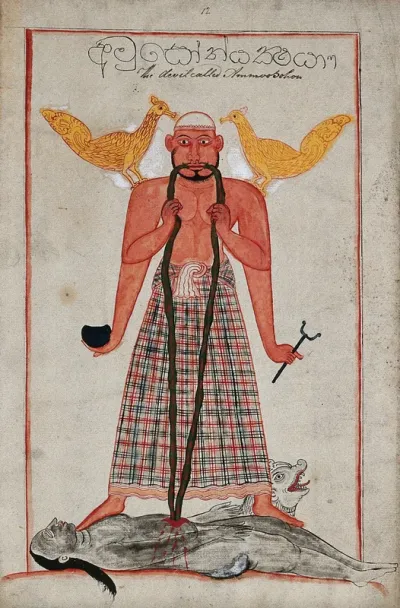 A Sinhalese four armed devil standing on top of a dead body sucking the blood through two long sticks with a peacock (?) perched on each shoulder