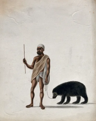 A street entertainer with his performing bear
