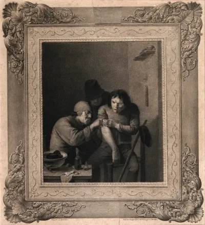 A surgeon attending to a man's arm