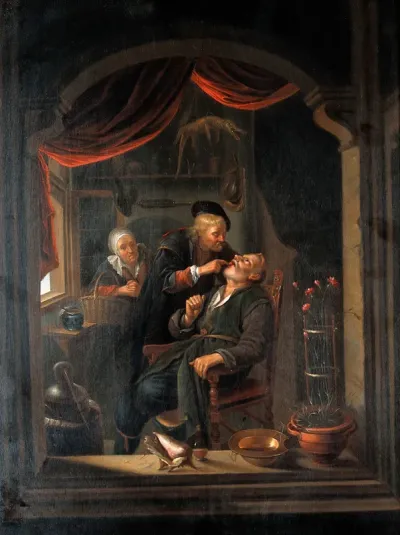 A surgeon examining a patient's mouth