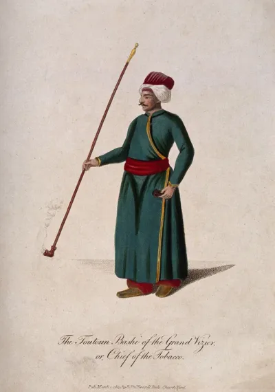 A Turkish official in robe and turban holding a long-stemmed pipe